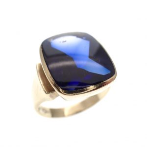 gouden Elvis ring blauwe steen