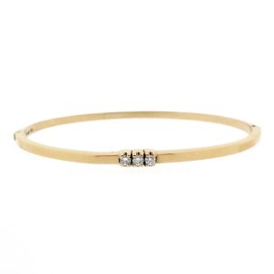 14 karaat geelgouden slavenarmband met drie diamanten van totaal 0,12 ct.