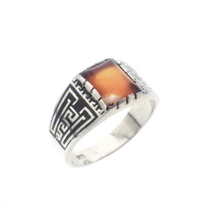 zilveren ring met oranje steen en maori patroon