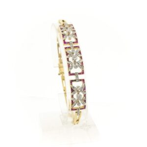 18 Krt. Gouden schakel armband met robijn en diamant; 0,89 ct. | 19,5 cm