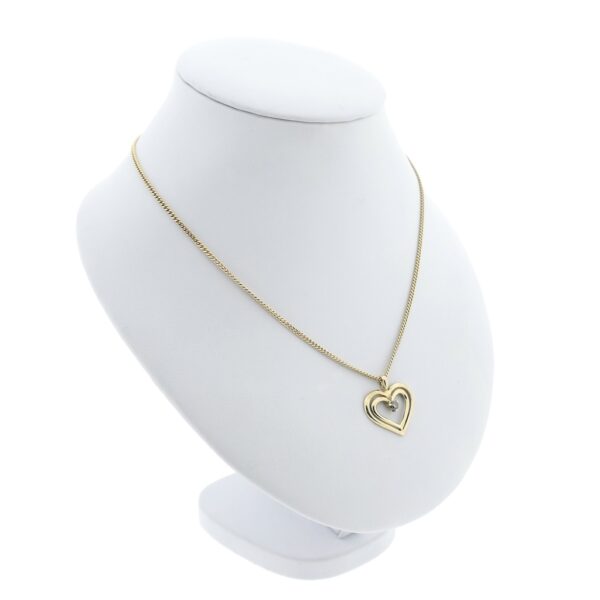 10 Krt. Hanger van een dubbel hart met diamant | 0,08 ct.